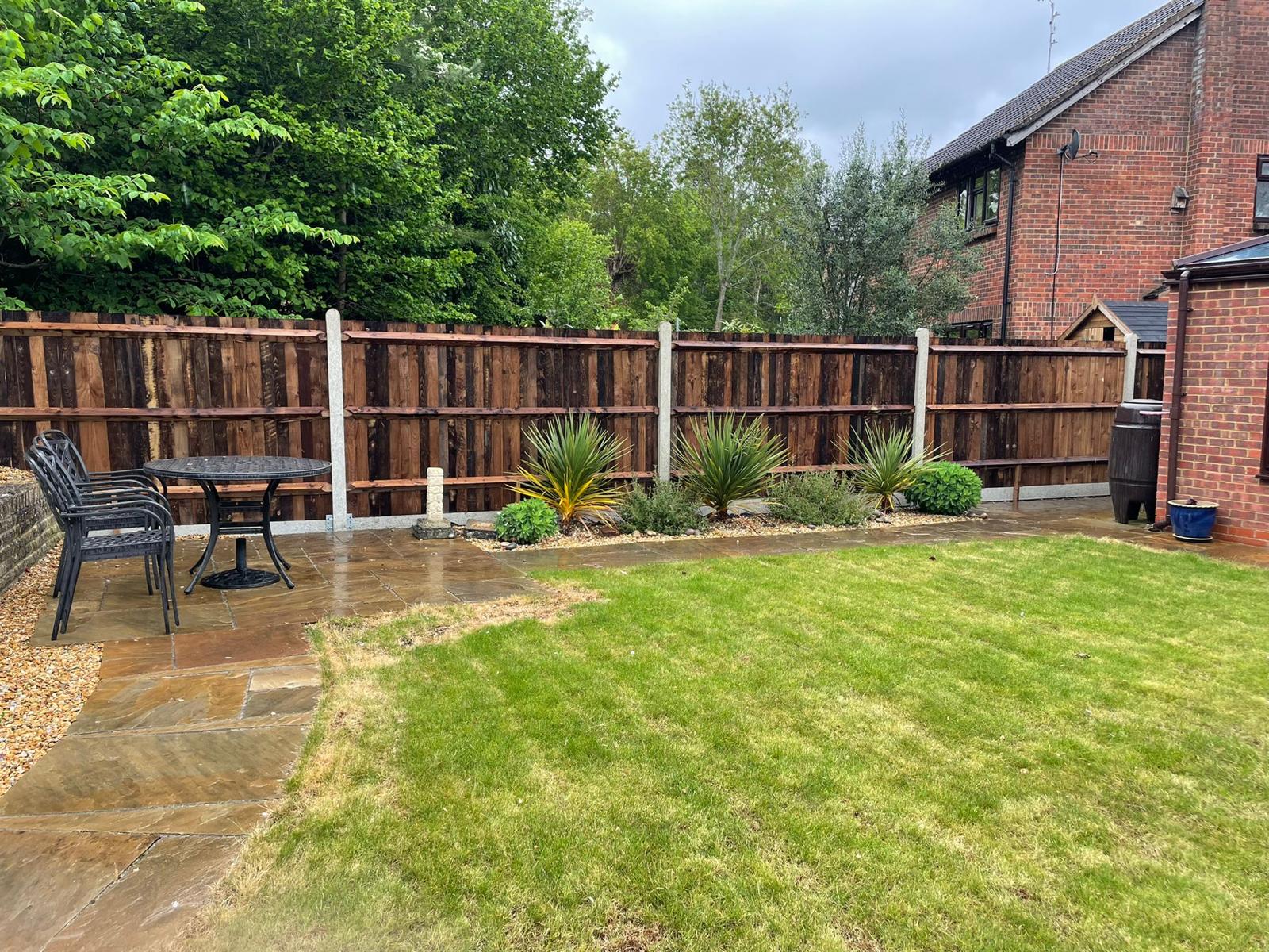Dark stained closeboard with garden